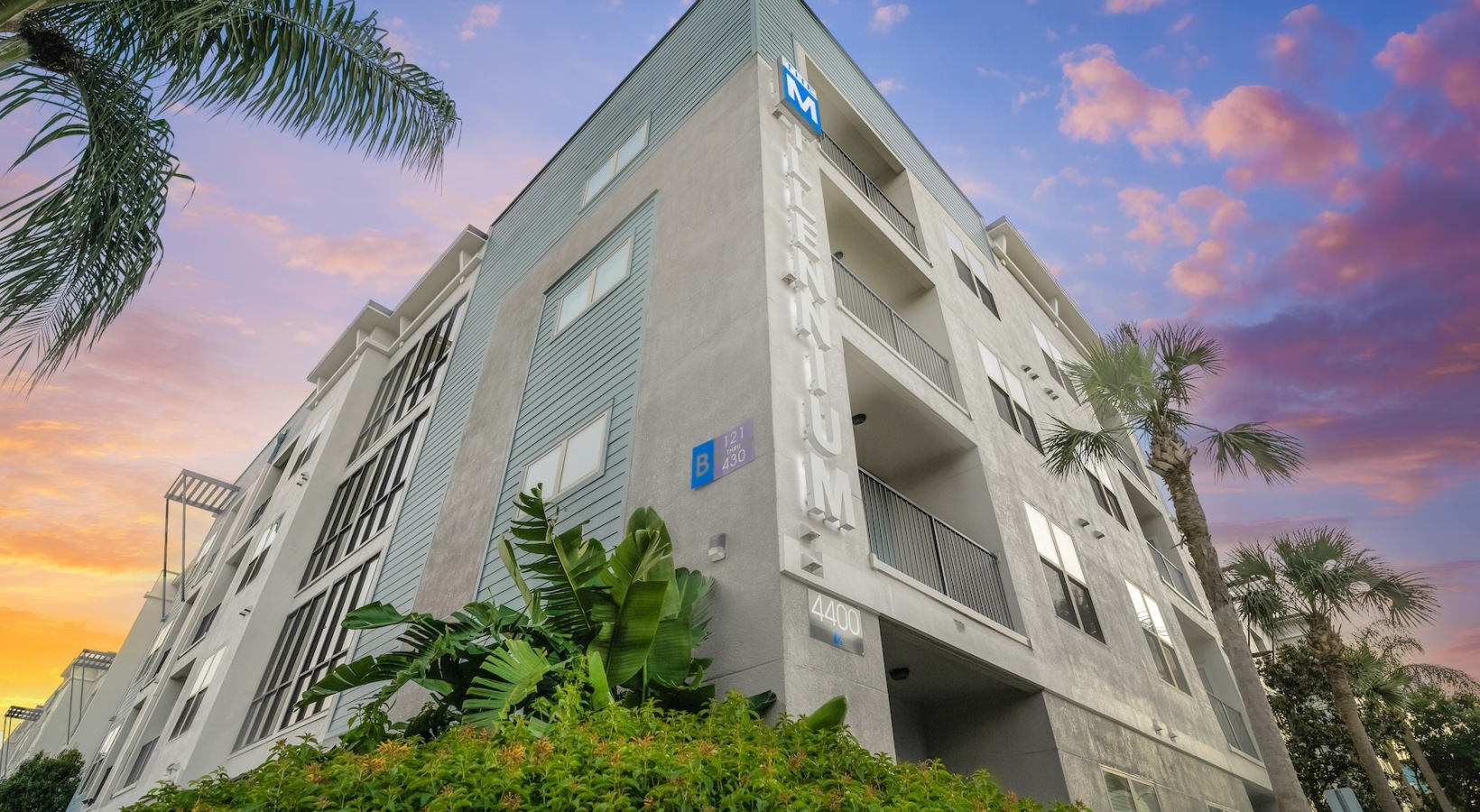 Close to Tampa International Airport (TPA) ground view of a building with a sunset in the background